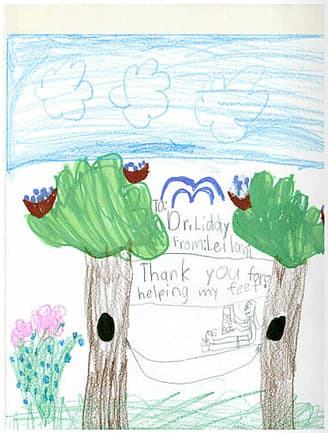 A child's crayon drawing thanking Dr. Liddy for helping their feet.