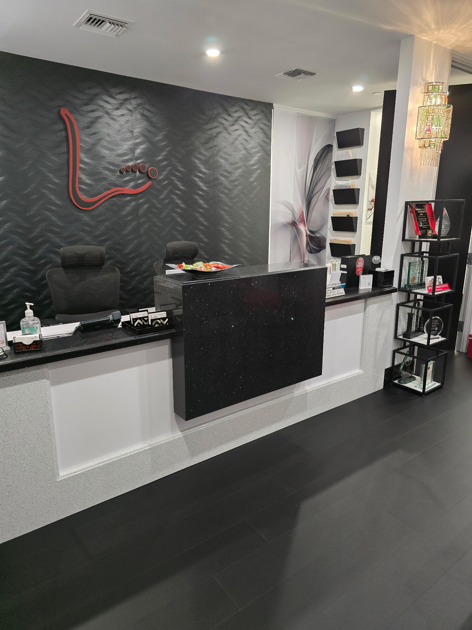 Reception desk with the Liddy Podiatry logo in Beverly Hills